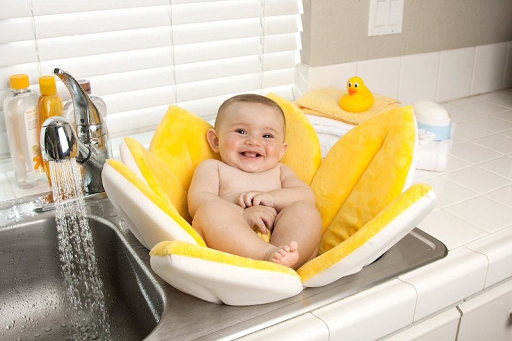 bathing baby in the kitchen sink